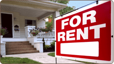 house with for rent sign in front